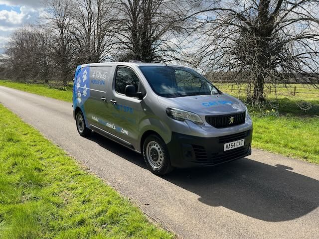 A 4 Paws Cat Spa van on a country lane